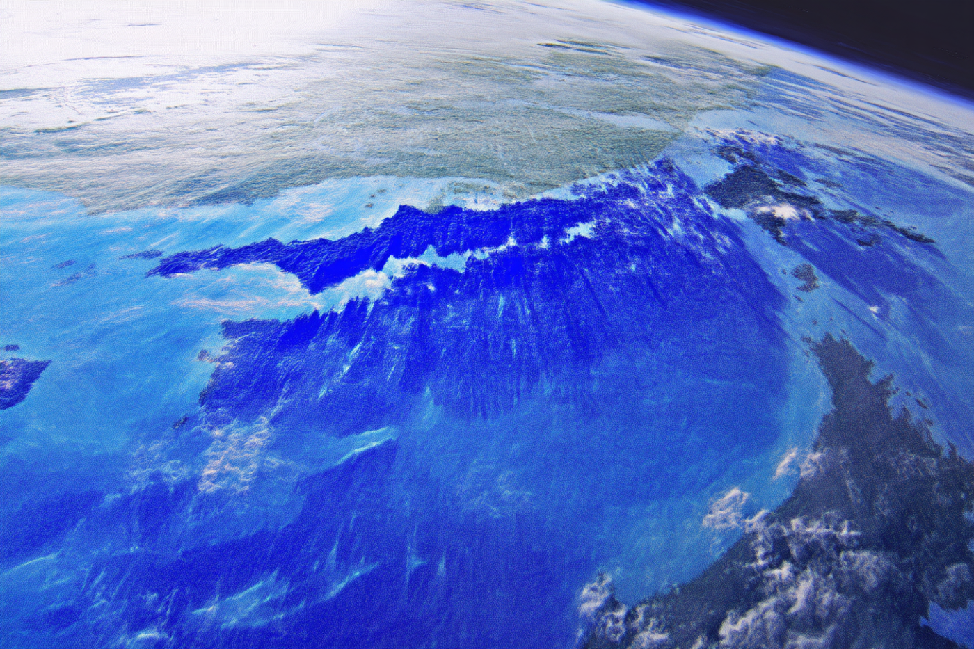 An image of vibrant blue planet in motion seemingly taken from orbit.